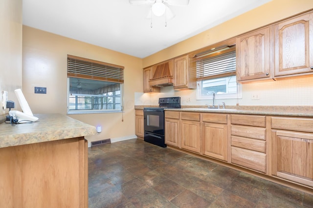 803 Wiltshire Rd, Columbus, OH 43204 - kitchen featuring electric range, light brown cabinetry, custom exhaust hood, tasteful backsplash, and a ceiling fan