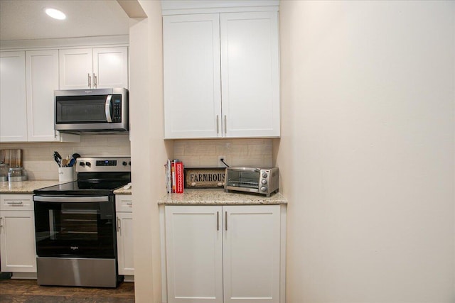 139 Preswicke Ml, Blacklick, OH 43004 - kitchen featuring appliances with stainless steel finishes, tasteful backsplash, white cabinetry, recessed lighting, and light stone counters