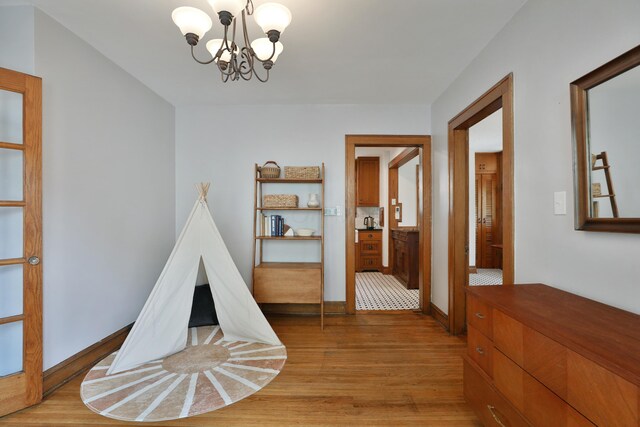203 Winthrop Rd, Columbus, OH 43214 - game room featuring light wood-style floors, a chandelier, and baseboards