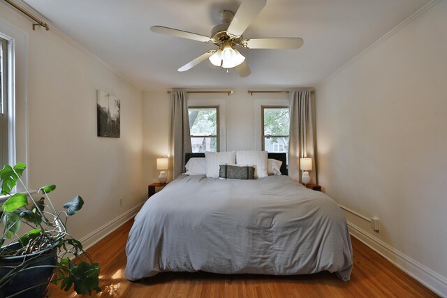 203 Winthrop Rd, Columbus, OH 43214 - bedroom featuring wood finished floors, baseboards, ornamental molding, and a ceiling fan