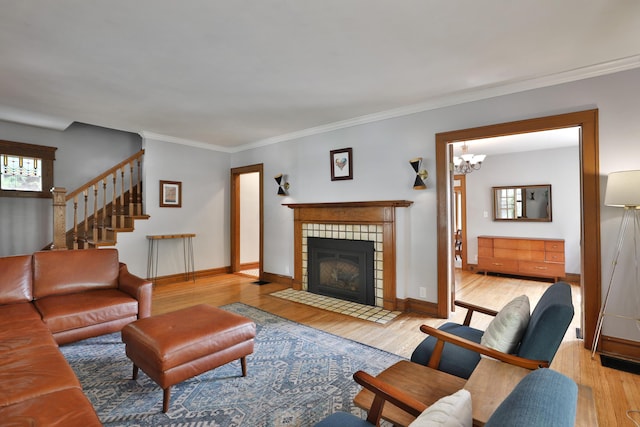 203 Winthrop Rd, Columbus, OH 43214 - living room with wood finished floors, a fireplace, crown molding, and baseboards