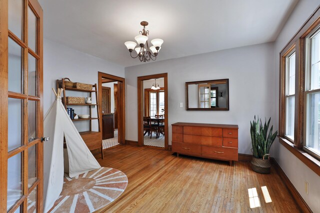203 Winthrop Rd, Columbus, OH 43214 - living area with a chandelier, light wood-type flooring, healthy amount of natural light, and baseboards