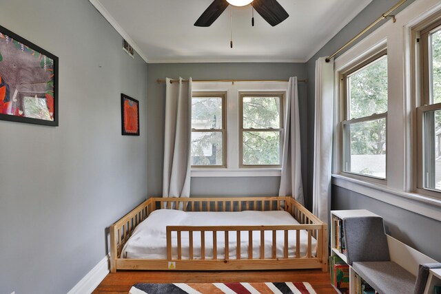 203 Winthrop Rd, Columbus, OH 43214 - bedroom featuring wood finished floors, ornamental molding, baseboards, and ceiling fan
