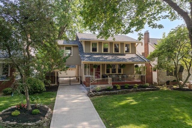 203 Winthrop Rd, Columbus, OH 43214 - view of front of house with concrete driveway, covered porch, a front yard, a shingled roof, and a chimney