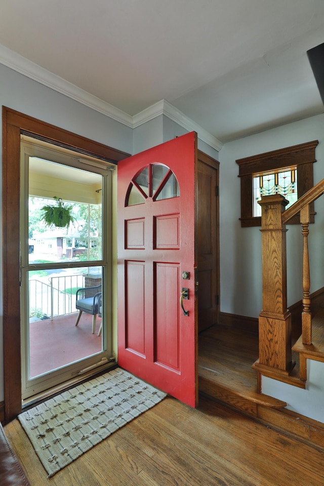 203 Winthrop Rd, Columbus, OH 43214 - entrance foyer featuring light wood-type flooring, plenty of natural light, ornamental molding, and stairway