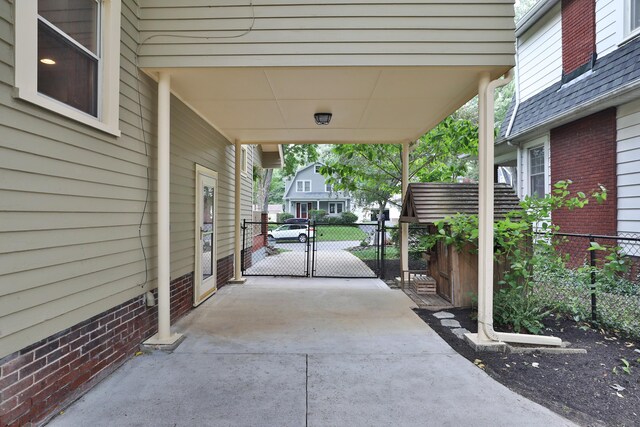 203 Winthrop Rd, Columbus, OH 43214 - view of patio with concrete driveway and a gate