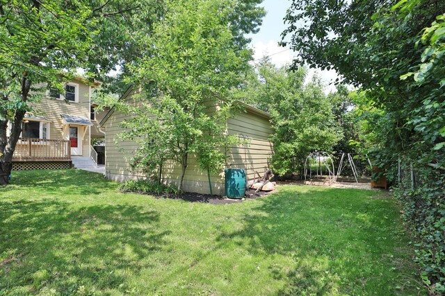 203 Winthrop Rd, Columbus, OH 43214 - view of grassy yard with a wooden deck