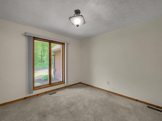 8587 Blacks Rd, Pataskala, OH 43062 - carpeted empty room featuring baseboards and a textured ceiling