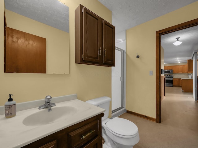 8587 Blacks Rd, Pataskala, OH 43062 - full bathroom featuring toilet, vanity, a shower with door, baseboards, and a textured ceiling