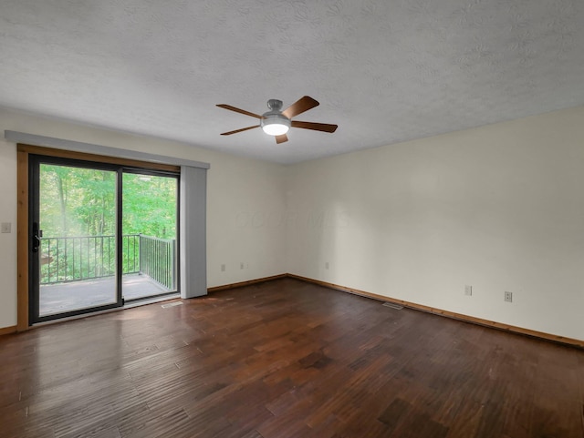 8587 Blacks Rd, Pataskala, OH 43062 - empty room with dark wood-style floors, baseboards, ceiling fan, and a textured ceiling