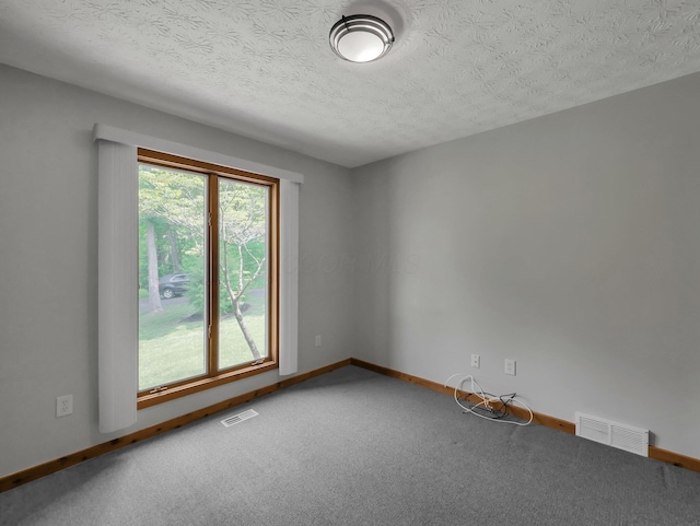 8587 Blacks Rd, Pataskala, OH 43062 - carpeted empty room with baseboards and a textured ceiling