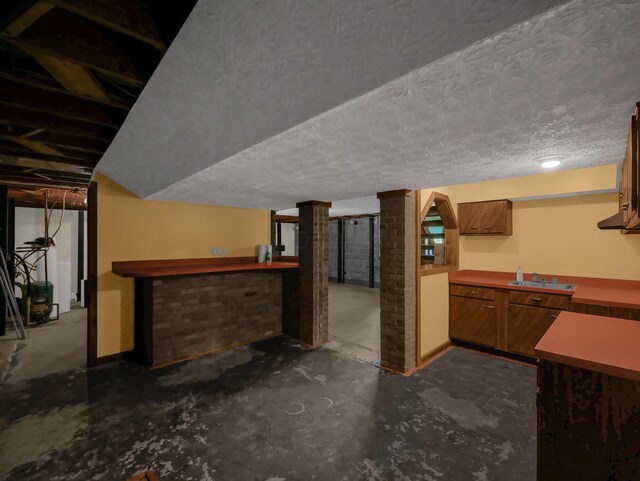8587 Blacks Rd, Pataskala, OH 43062 - indoor dry bar with unfinished concrete floors and a textured ceiling