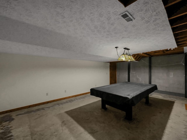 8587 Blacks Rd, Pataskala, OH 43062 - rec room with baseboards, billiards table, a textured ceiling, and concrete floors