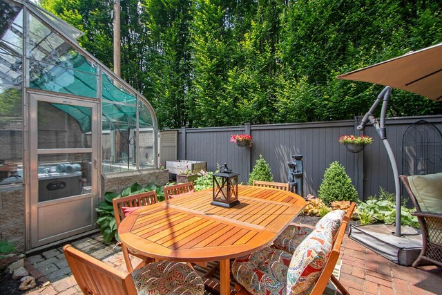 651 S 6th St, Columbus, OH 43206 - wooden terrace featuring an exterior structure, a fenced backyard, outdoor dining area, a patio area, and an outbuilding