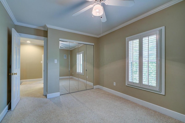 651 S 6th St, Columbus, OH 43206 - unfurnished bedroom with ornamental molding, carpet flooring, baseboards, a closet, and a ceiling fan