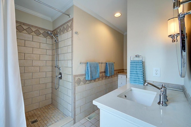 651 S 6th St, Columbus, OH 43206 - bathroom with ornamental molding, a shower stall, vanity, tile walls, and recessed lighting