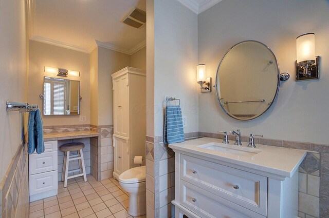 651 S 6th St, Columbus, OH 43206 - bathroom featuring tile walls, tile patterned flooring, ornamental molding, vanity, and toilet