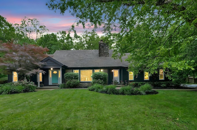 6233 Coonpath Rd NW, Carroll, OH 43112 - view of front of house featuring a front lawn and a chimney