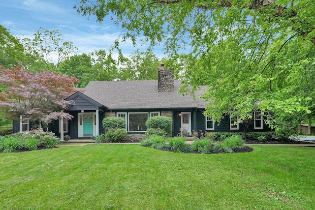 6233 Coonpath Rd NW, Carroll, OH 43112 - view of front of house with a front lawn, a chimney, and a shingled roof