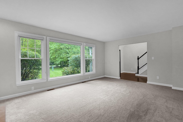6233 Coonpath Rd NW, Carroll, OH 43112 - carpeted spare room with stairs and baseboards