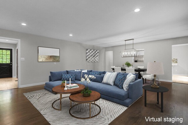 6233 Coonpath Rd NW, Carroll, OH 43112 - living room featuring wood finished floors, recessed lighting, and a chandelier