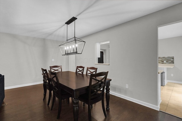6233 Coonpath Rd NW, Carroll, OH 43112 - dining area featuring a chandelier and wood finished floors