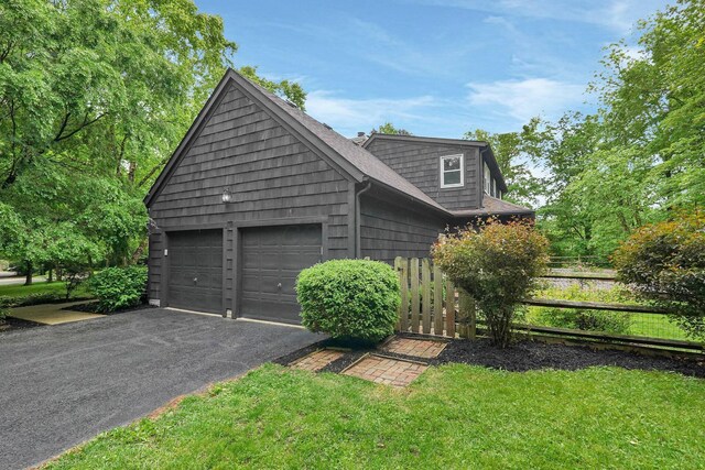 6233 Coonpath Rd NW, Carroll, OH 43112 - view of front of home featuring driveway and a garage
