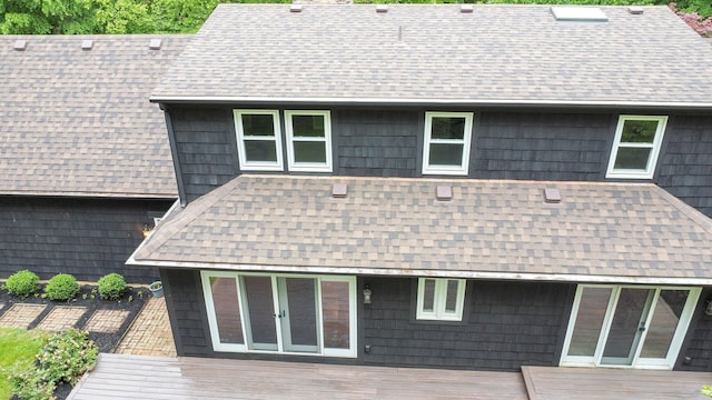 6233 Coonpath Rd NW, Carroll, OH 43112 - rear view of house featuring roof with shingles, a chimney, and a deck