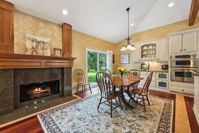 5337 Teresas Trl, Galena, OH 43021 - dining room featuring lofted ceiling, a fireplace, dark wood-style flooring, and recessed lighting