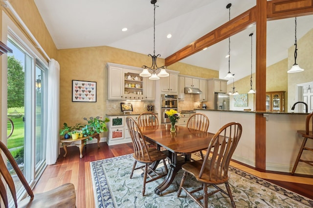 5337 Teresas Trl, Galena, OH 43021 - dining room with lofted ceiling, dark wood-style floors, and recessed lighting