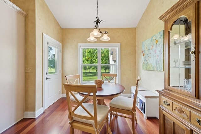 5337 Teresas Trl, Galena, OH 43021 - dining space featuring dark wood finished floors, a chandelier, baseboards, and lofted ceiling