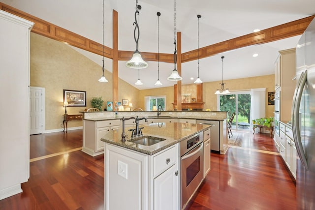 5337 Teresas Trl, Galena, OH 43021 - kitchen with a sink, a center island with sink, dark wood-style flooring, and high vaulted ceiling