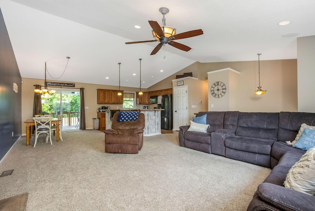 765 Huntley Ave, Logan, OH 43138 - living room with vaulted ceiling, light colored carpet, ceiling fan, recessed lighting, and a chandelier