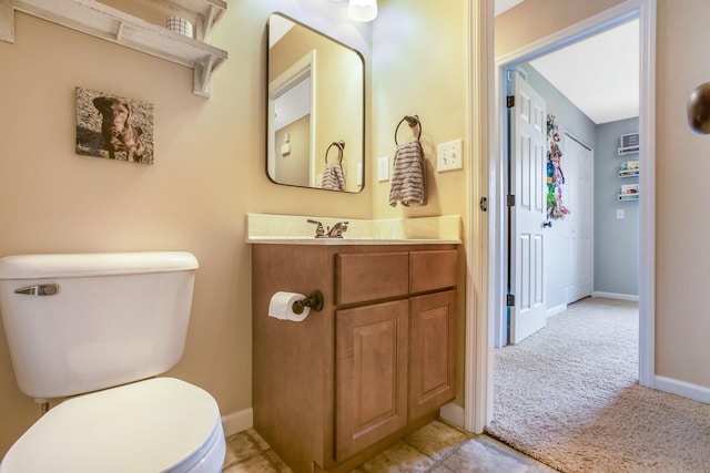 765 Huntley Ave, Logan, OH 43138 - bathroom with toilet, vanity, and baseboards