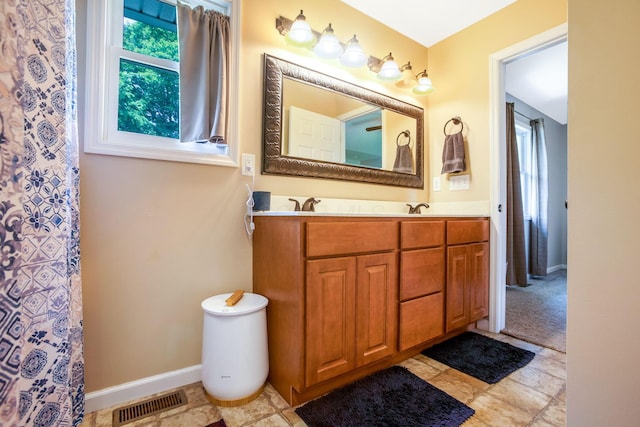 765 Huntley Ave, Logan, OH 43138 - full bathroom with double vanity and baseboards
