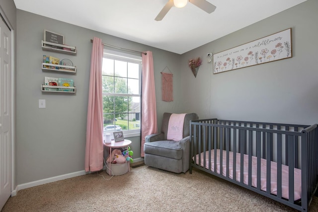 765 Huntley Ave, Logan, OH 43138 - bedroom with carpet floors, a nursery area, ceiling fan, and baseboards