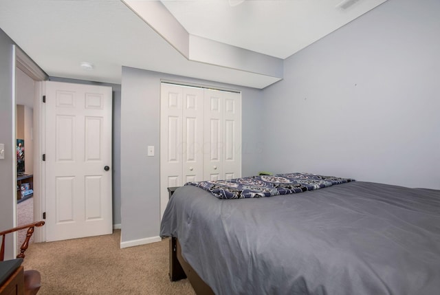 765 Huntley Ave, Logan, OH 43138 - bedroom featuring light carpet, a closet, and baseboards
