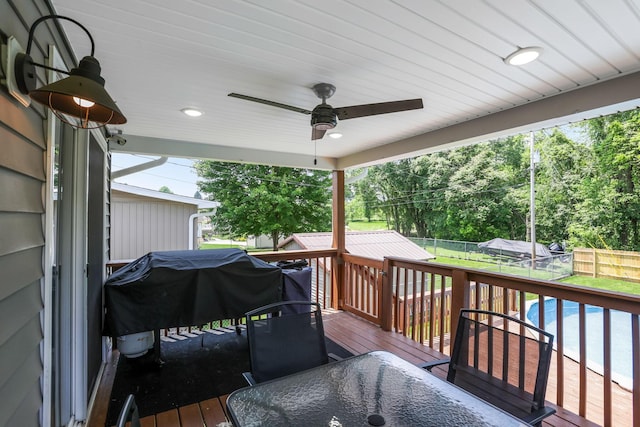 765 Huntley Ave, Logan, OH 43138 - deck featuring a fenced backyard, a ceiling fan, outdoor dining area, and view of wooded area