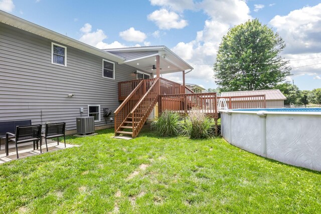 765 Huntley Ave, Logan, OH 43138 - rear view of property with a lawn, a ceiling fan, a deck, and stairway