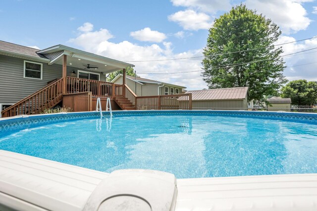765 Huntley Ave, Logan, OH 43138 - swimming pool featuring stairs, ceiling fan, and a wooden deck