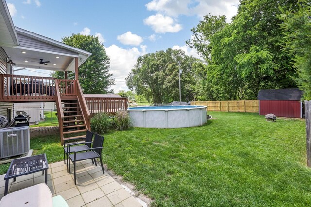 765 Huntley Ave, Logan, OH 43138 - view of yard with stairs, a wooden deck, a ceiling fan, and central AC unit