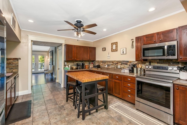 26110 Big Pine Rd, Rockbridge, OH 43149 - kitchen featuring stainless steel appliances, decorative backsplash, french doors, a ceiling fan, and recessed lighting