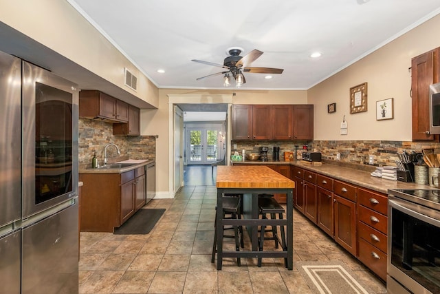 26110 Big Pine Rd, Rockbridge, OH 43149 - kitchen featuring stainless steel appliances, ornamental molding, tasteful backsplash, a ceiling fan, and recessed lighting