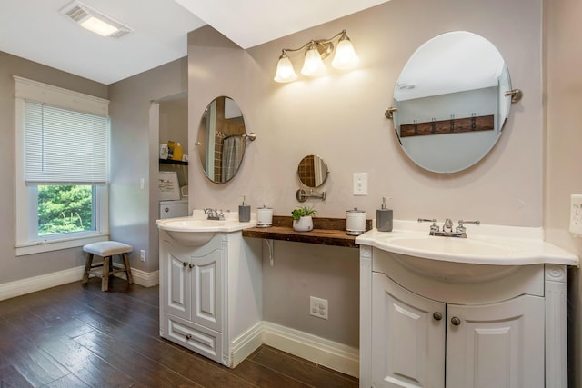 26110 Big Pine Rd, Rockbridge, OH 43149 - bathroom with two vanities and wood finished floors