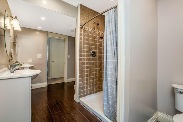 26110 Big Pine Rd, Rockbridge, OH 43149 - full bathroom with double vanity, tiled shower, wood finished floors, and recessed lighting