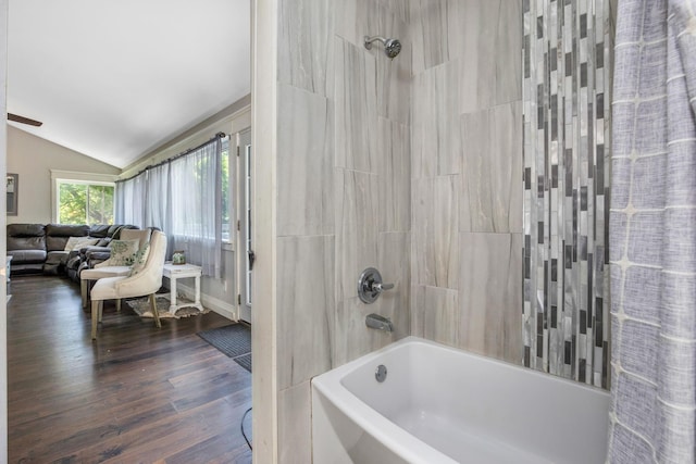 26110 Big Pine Rd, Rockbridge, OH 43149 - bathroom featuring vaulted ceiling, washtub / shower combination, and wood finished floors