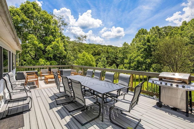 26110 Big Pine Rd, Rockbridge, OH 43149 - wooden deck with a grill, outdoor dining space, a wooded view, and outdoor lounge area
