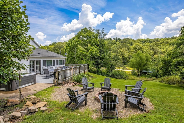 26110 Big Pine Rd, Rockbridge, OH 43149 - view of grassy yard featuring an outdoor fire pit, outdoor dining space, and a forest view