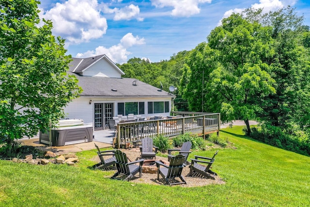 26110 Big Pine Rd, Rockbridge, OH 43149 - back of house with a hot tub, a fire pit, a yard, french doors, and a deck