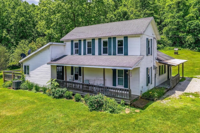 26110 Big Pine Rd, Rockbridge, OH 43149 - view of front of property featuring covered porch, a front lawn, roof with shingles, and a wooded view